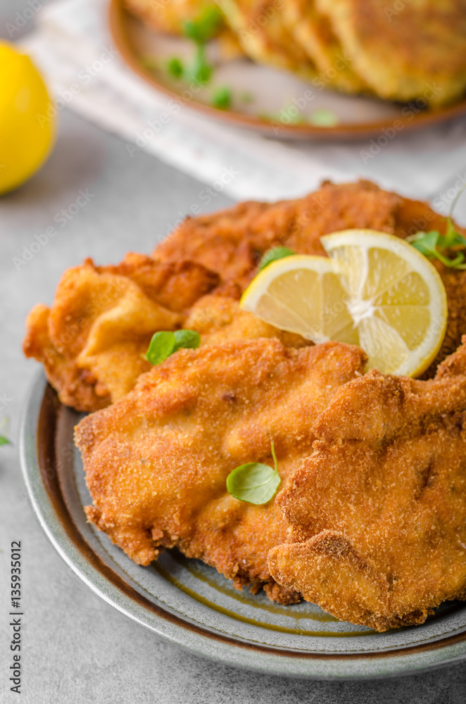 Delicious original schnitzel with potato pancakes Delicious original schnitzel with potato pancakes