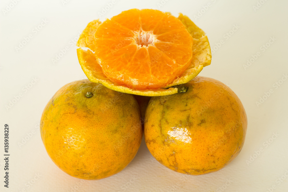 Ripe oranges isolated on white background. Orange in a cut Ripe oranges isolated on white background. Orange in a cut