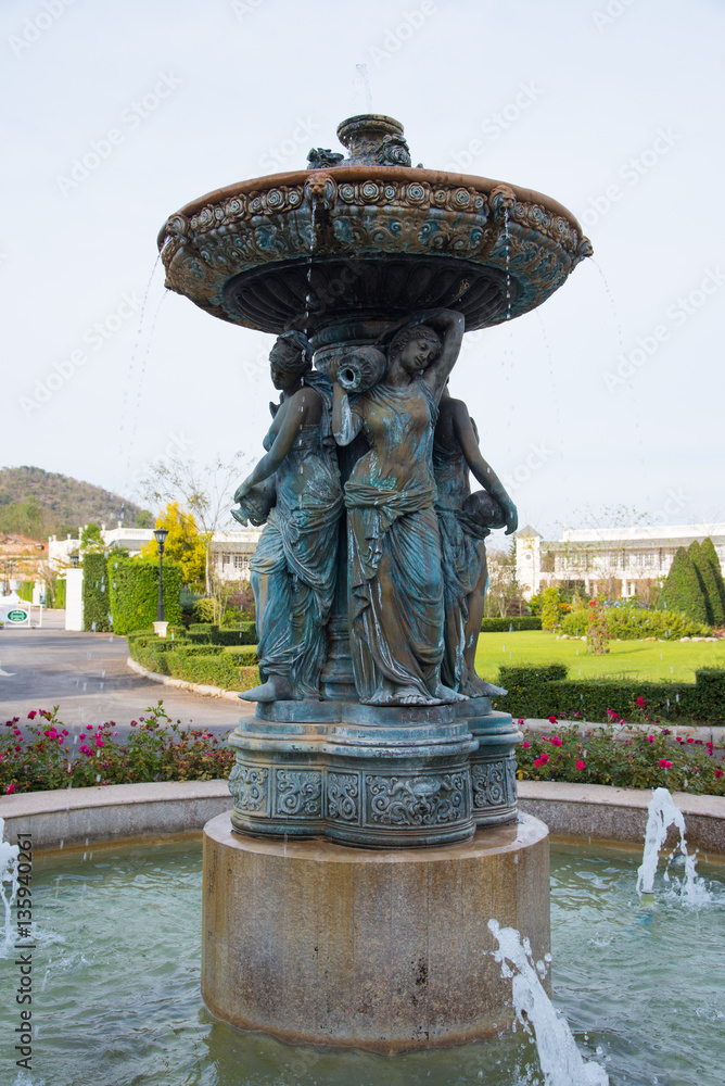 Fountain water statue in garden by English style.