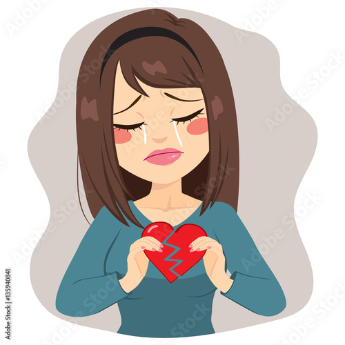 Young sad woman holding two...