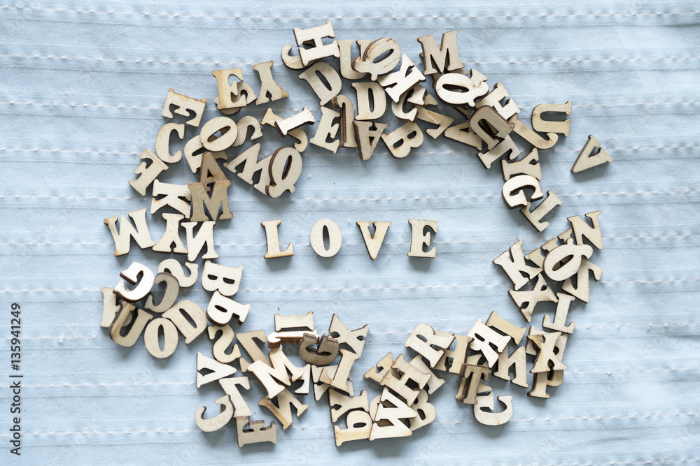 text made from plywood arrange LOVE on sheet .