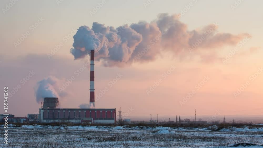 Russia timelapse. Clouds of steam cogeneration plant over winter evening at sunset. Russia timelapse. Clouds of steam cogeneration plant over winter evening at sunset.