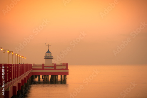 Scenic view red pier at sunrise in Thailand.