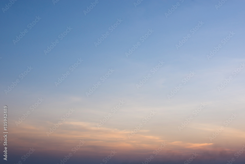 The sky in orange and blue shades, nature background.
