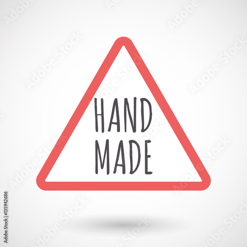 Isolated warning signal with    the text HAND MADE