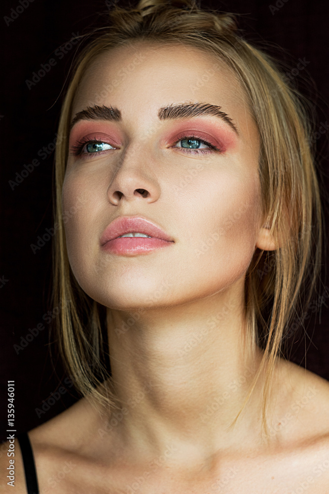Obraz premium Beauty Portrait of Woman with Pink Eyeshadow and Natural Glow Skin Close Up