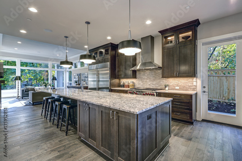 Cuadro en lienzo Modern kitchen with brown kitchen cabinets