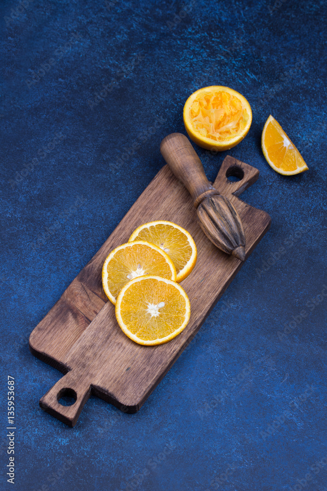 Fresh oranges, grapefruits and madarine slices on dark stone background. Fresh oranges, grapefruits and madarine slices on dark stone background.