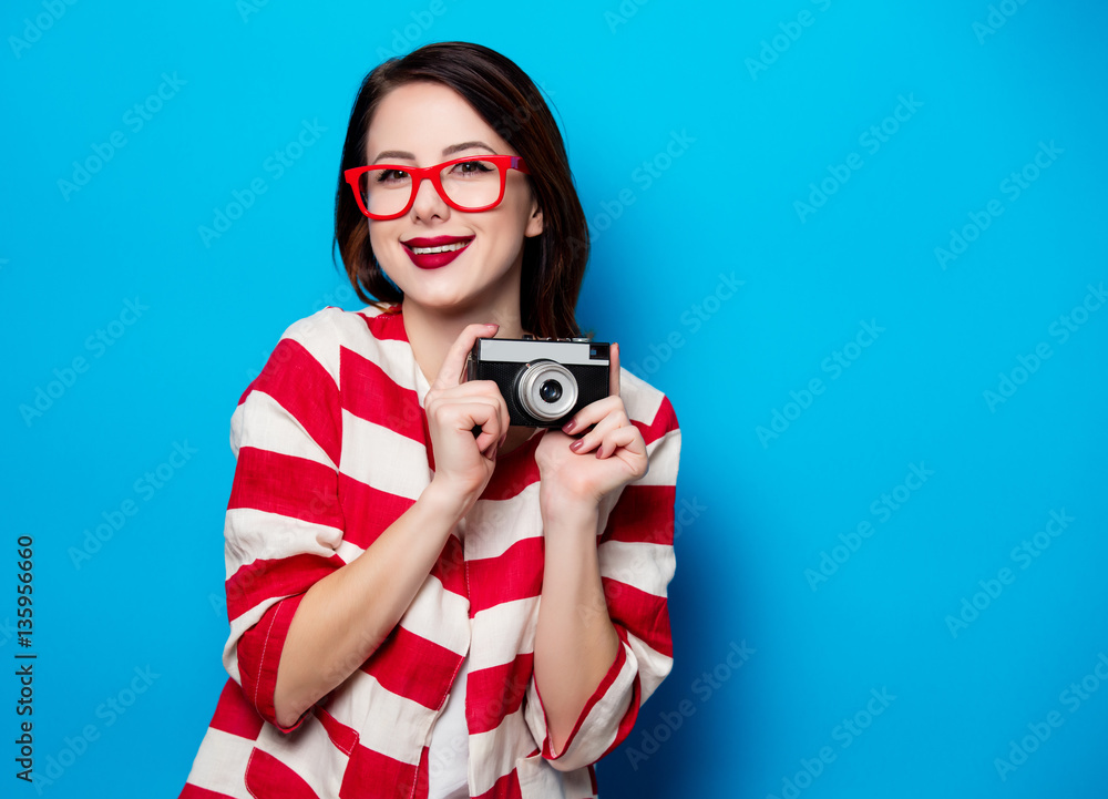 young smiling woman with retro camera young smiling woman with retro camera