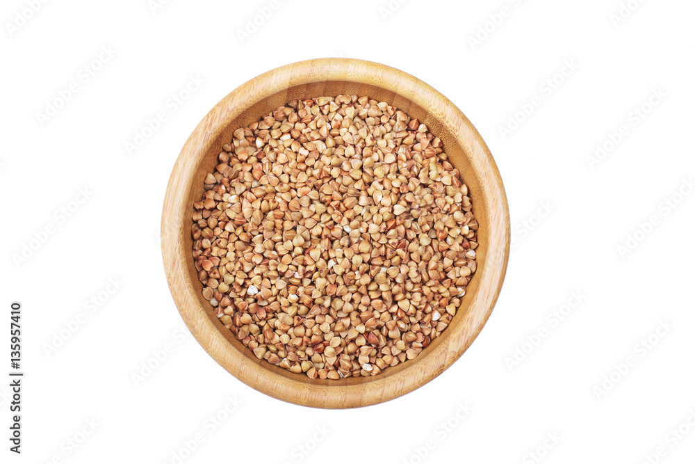 Buckwheat in bowl isolated on white background.Top view. Buckwheat in bowl isolated on white background.Top view.