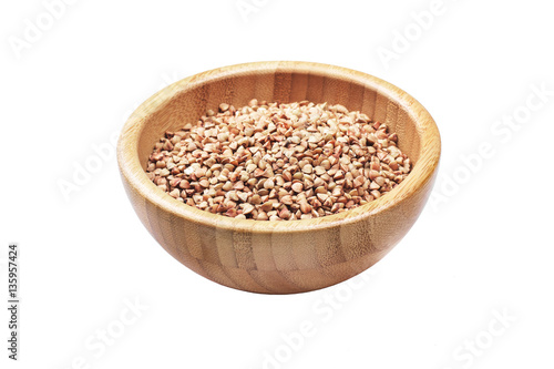 Buckwheat in bowl isolated on white background.