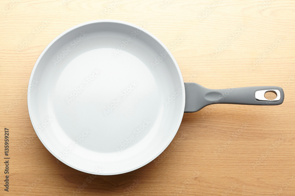 Frying pan isolated on white background with shadow Frying pan isolated on white background with shadow