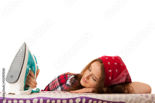 Woman falls asleep while ironing isolated over white background