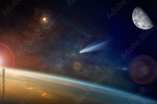 Fototapeta Naklejka Na Ścianę i Meble -  Bright comet approaching to planet Earth in space