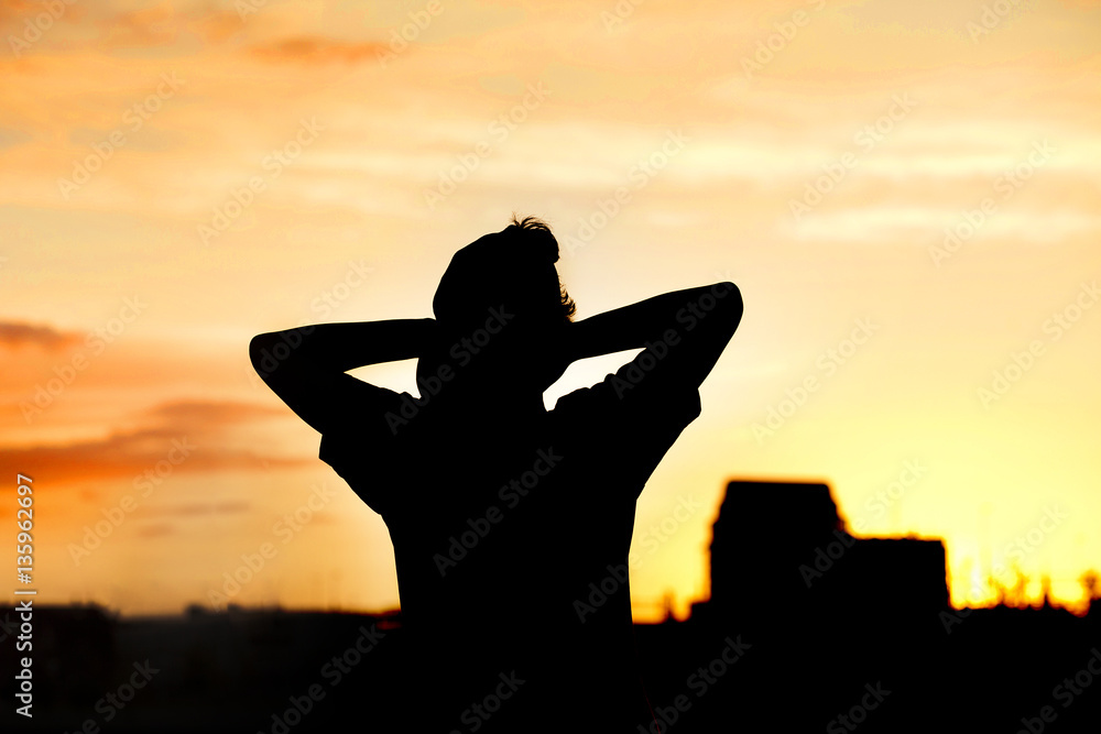 Silhouette of person in sunset.