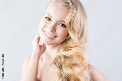 Portrait of beautiful smiling blonde. Health and Beauty.