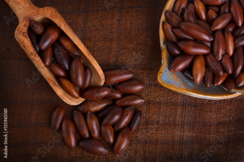 Baru almond on wooden background photo