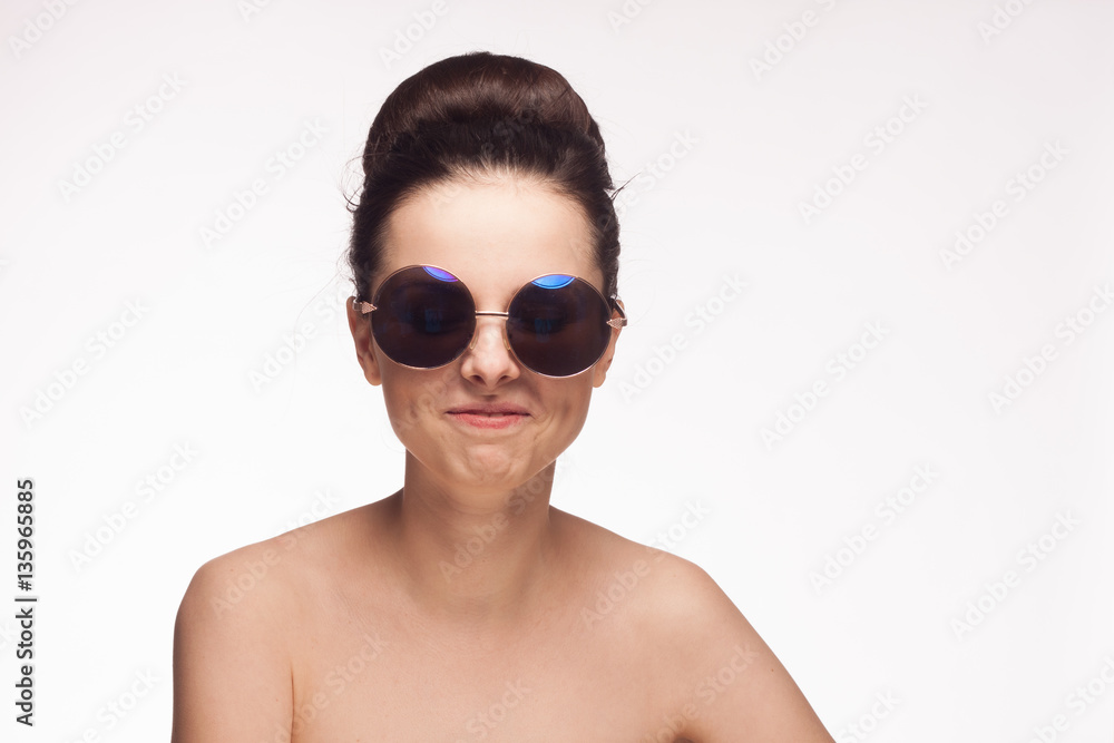 fashionable woman in sunglasses, light background fashionable woman in sunglasses, light background
