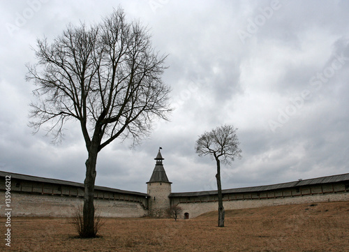 Two trees, the walls and the Kutekroma Tower in Pskov Kremlin, Pskov, Russia photo