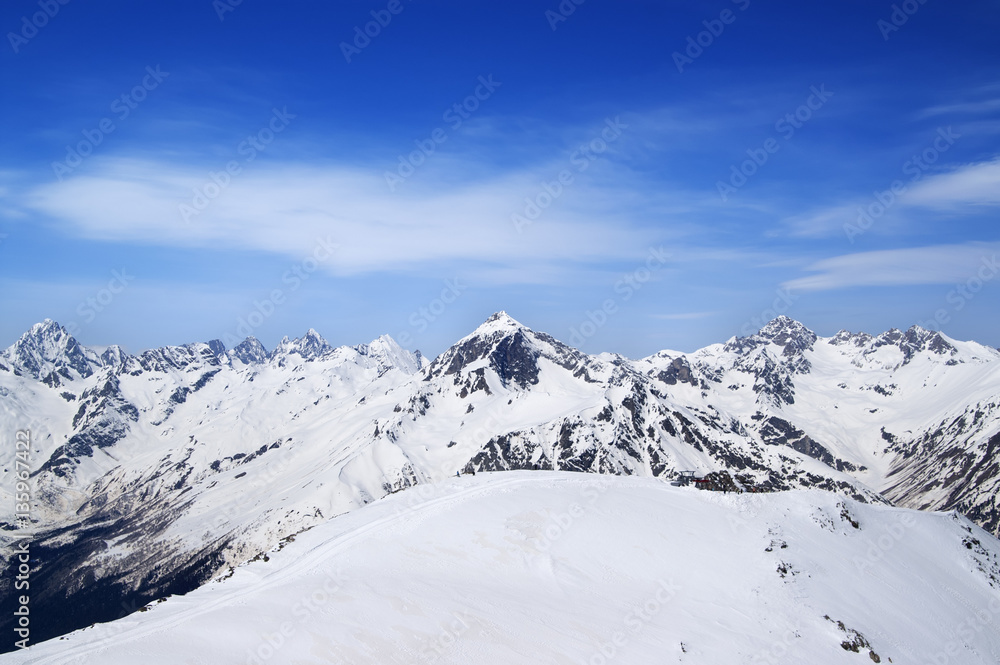 Mountain peaks and off-piste slope for freeriding in sun winter