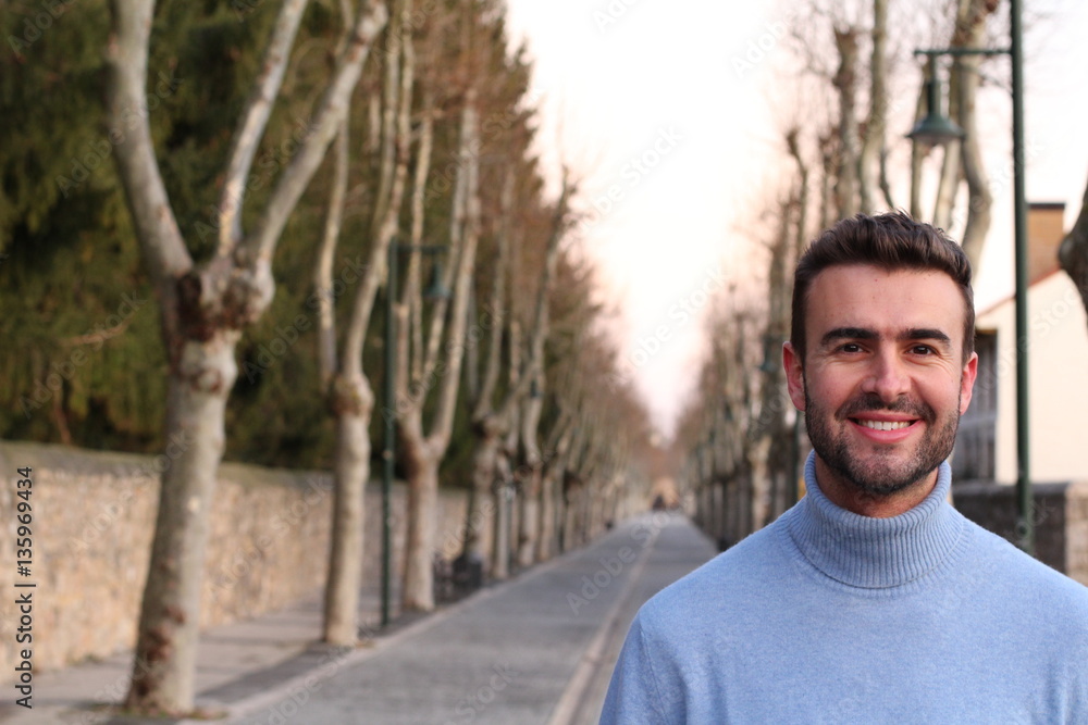 Handsome man smiling outdoors in the winter Handsome man smiling outdoors in the winter