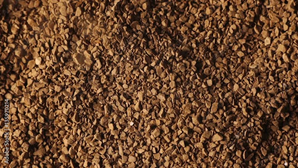 Falling grain of ground coffee Falling grain of ground coffee
