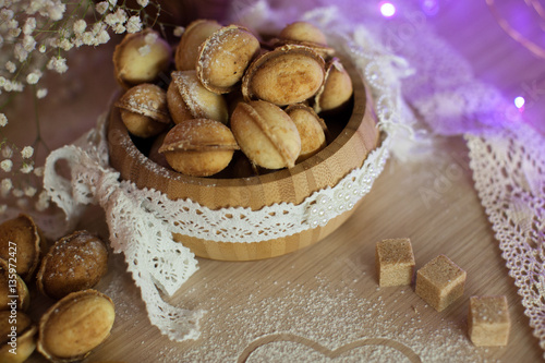 Homemade nuts cookies on old wooden table. Holiday decoration ho