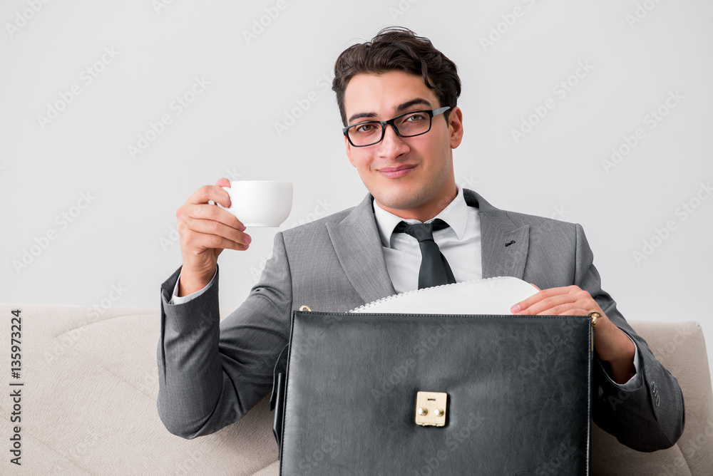 Businessman with briefcase in business concept Businessman with briefcase in business concept