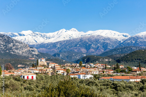 mountain village under the snow covered peak, Greece, Europe