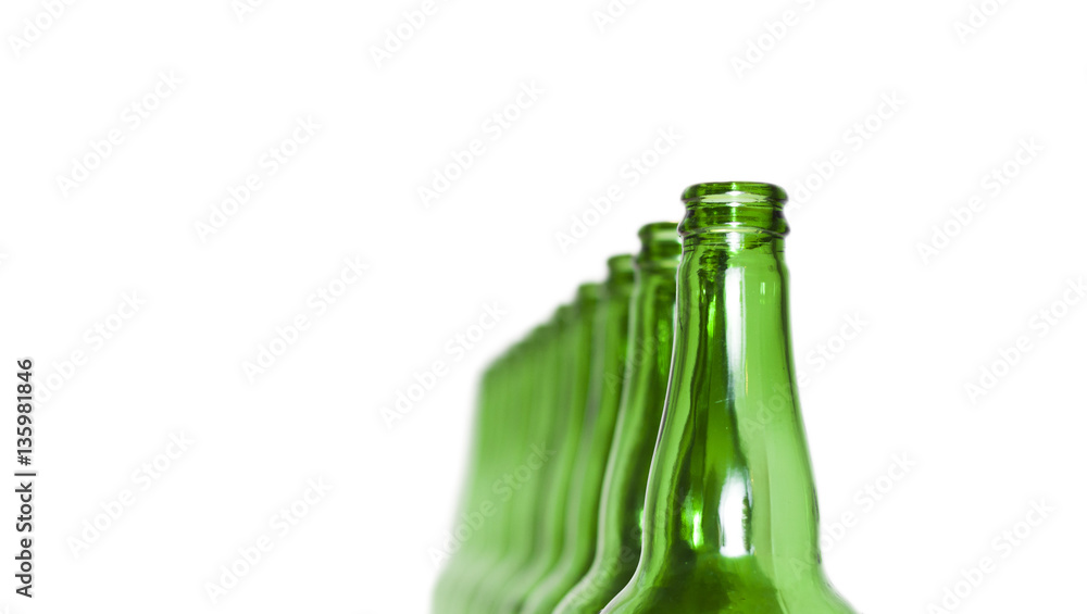 Row of open empty green bottles isolated on white background Row of open empty green bottles isolated on white background