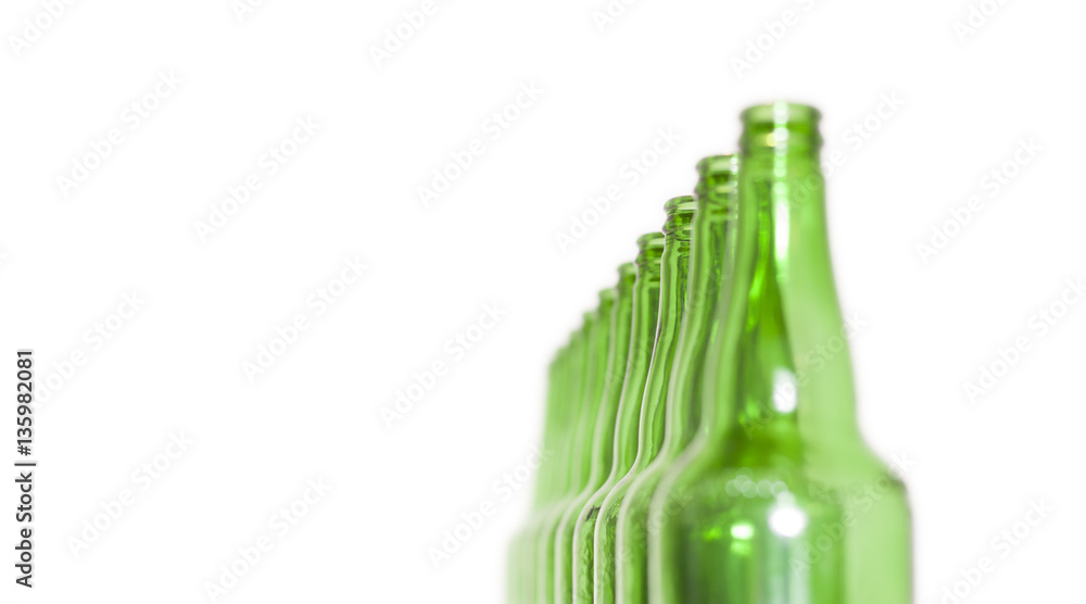 Row of open empty green bottles isolated on white background Row of open empty green bottles isolated on white background