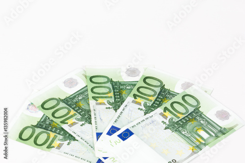 One hundred euro banknotes on white background