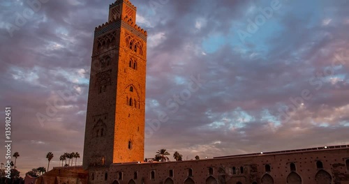Timelapse Koutoubia Mosque in Marrakech at sunset on background of clouds, Morocco