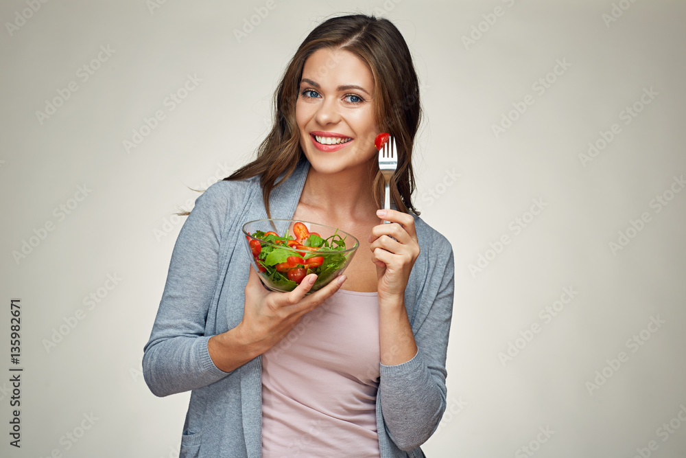 isolated portrait of happy woman eating green salad isolated portrait of happy woman eating green salad