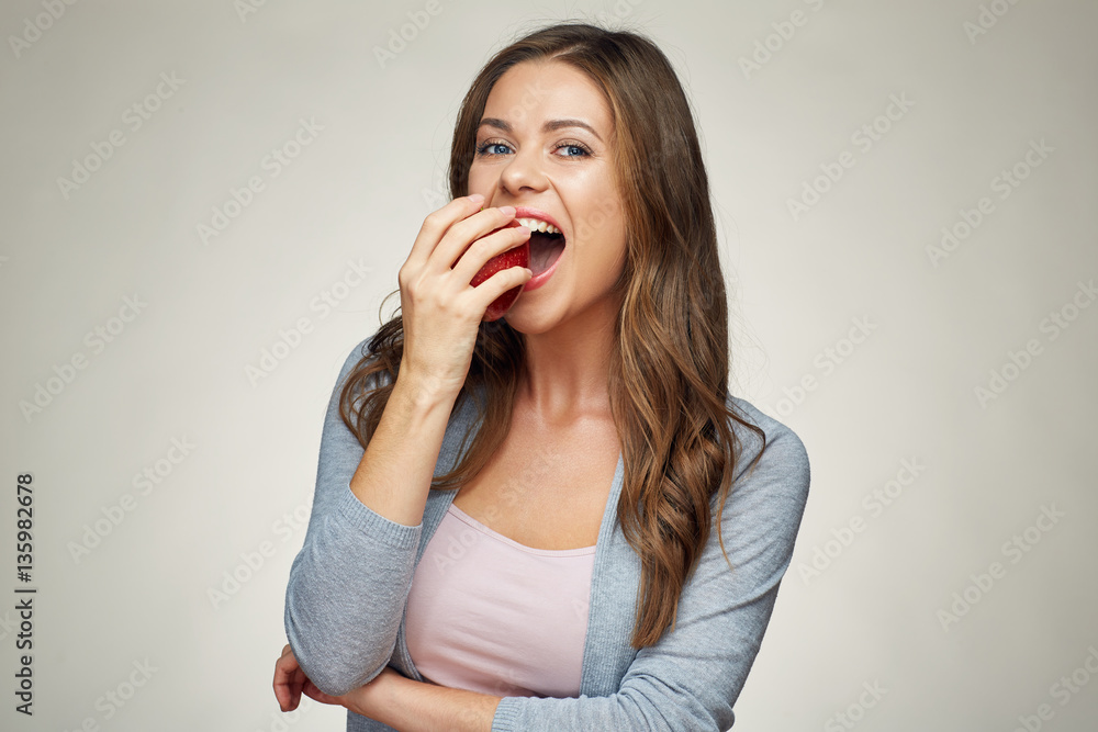 young woman bite red apple. healthy teeth. young woman bite red apple. healthy teeth.