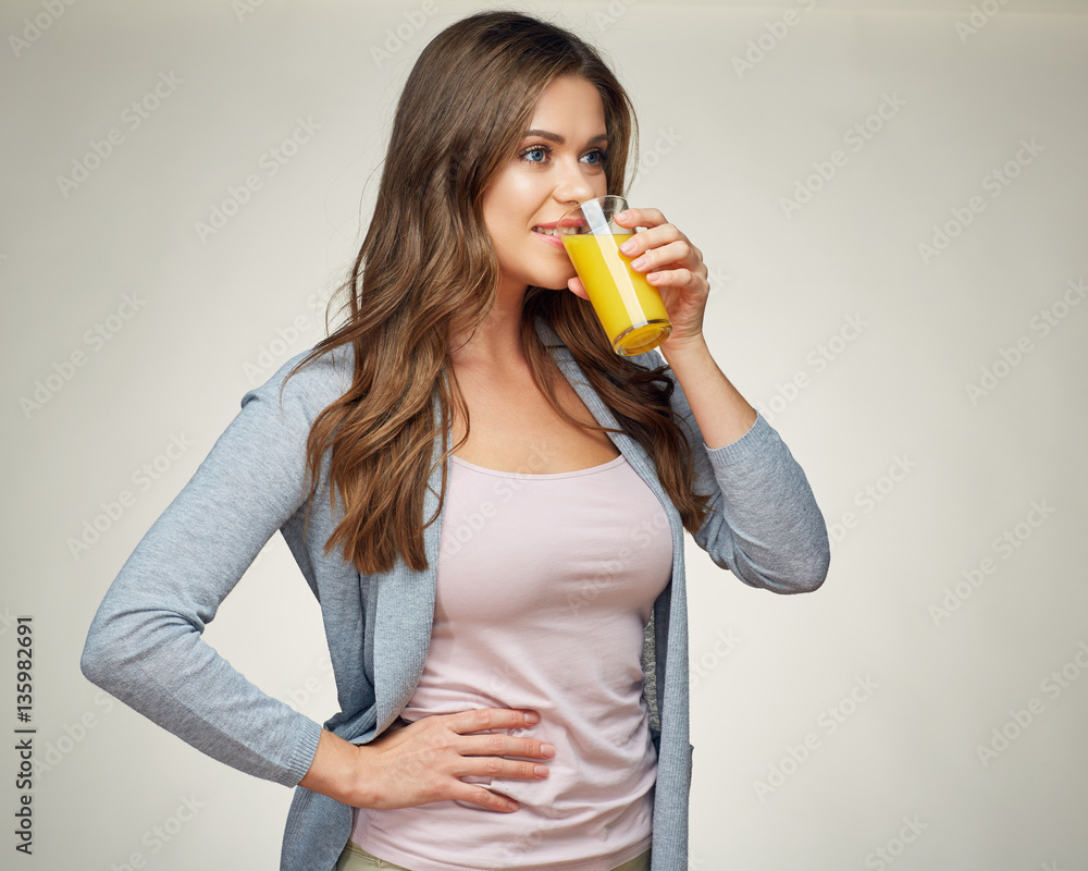casual dressed woman drink orange juice with glass. casual dressed woman drink orange juice with glass.