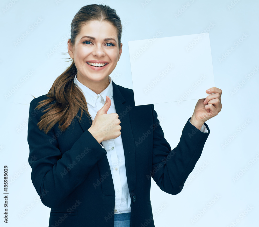 Smiling business woman in suit holding white blank sign board. Smiling business woman in suit holding white blank sign board.