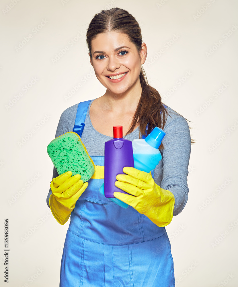 Woman cleaning company worker holding equipment for cleaning hou Woman cleaning company worker holding equipment for cleaning hou