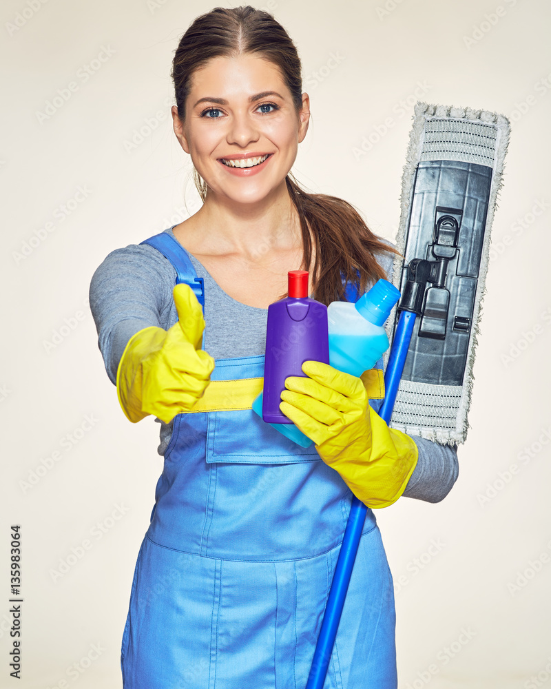 Woman cleaning company worker holding equipment for cleaning hou Woman cleaning company worker holding equipment for cleaning hou