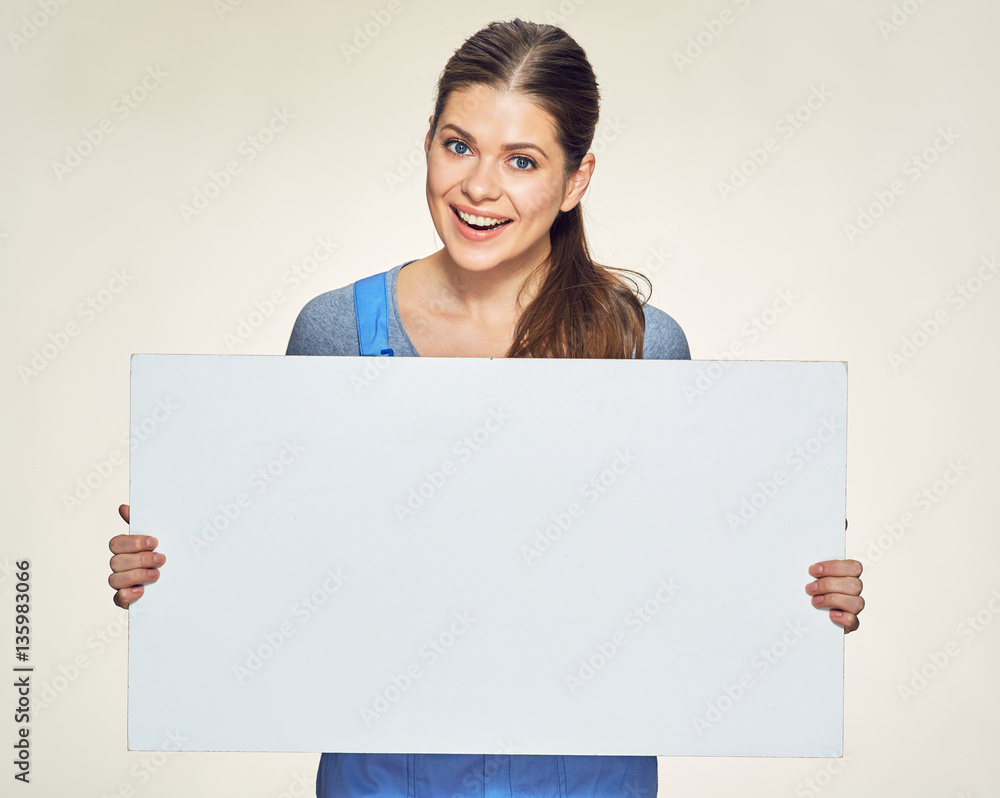 Young smiling woman holding white banner. Young smiling woman holding white banner.