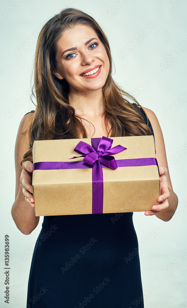 Fototapeta premium Happy woman holding gift box.