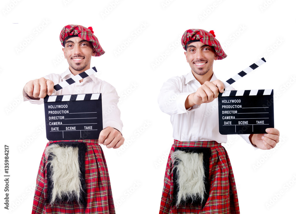 Scotsman with movie board on white