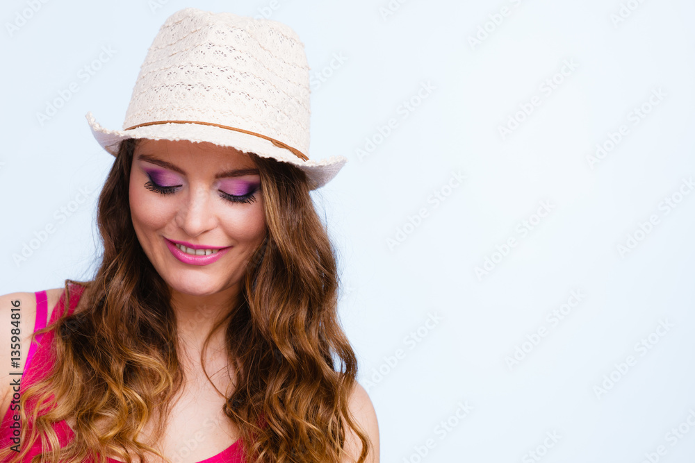 Woman in summer straw hat on head smiling Woman in summer straw hat on head smiling