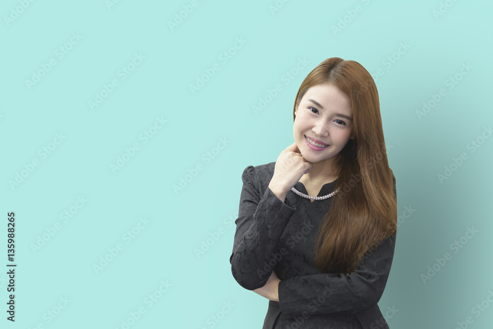 A smile face of pretty Asian business women with the light green background A smile face of pretty Asian business women with the light green background