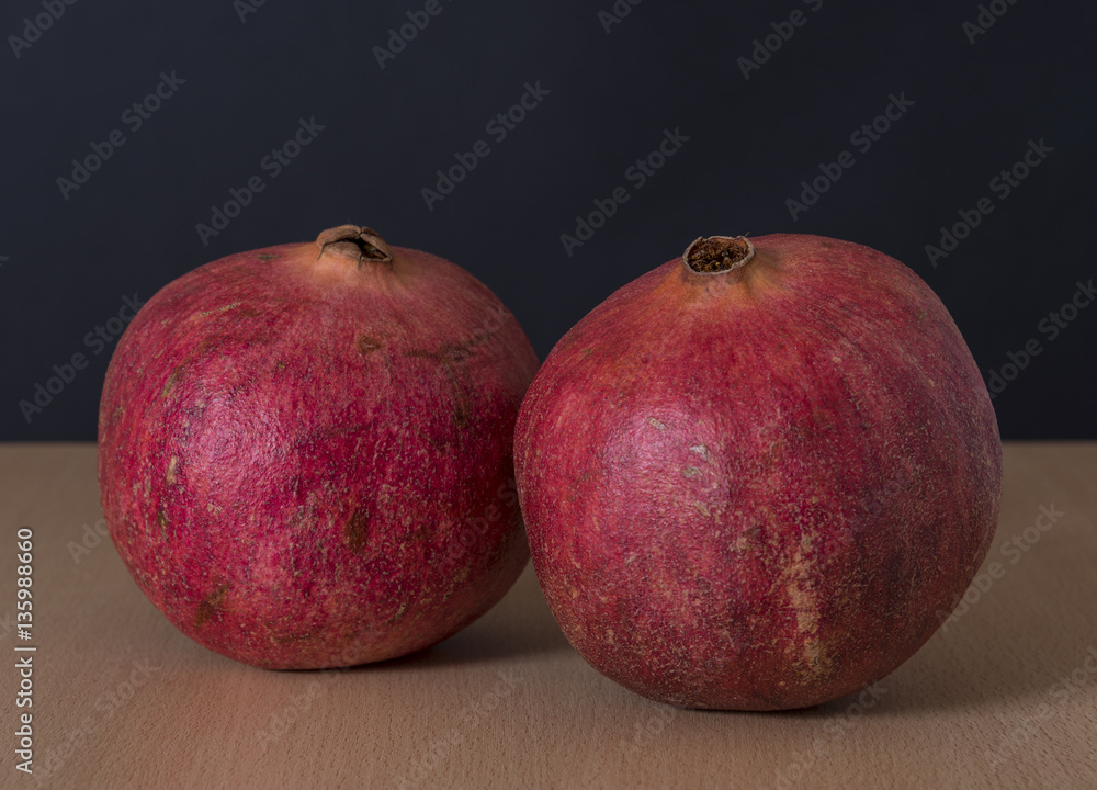 Ripe pomegranate fruit isolated on black background Ripe pomegranate fruit isolated on black background