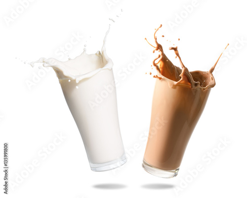 Milk and chocolate milk splashing out of glass., Isolated white background.