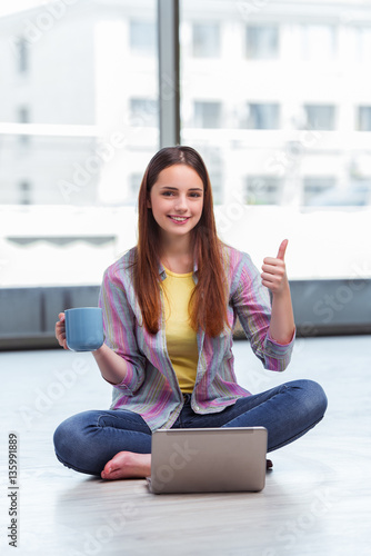Free Download Young girl surfing internet on laptop - GFXLoad