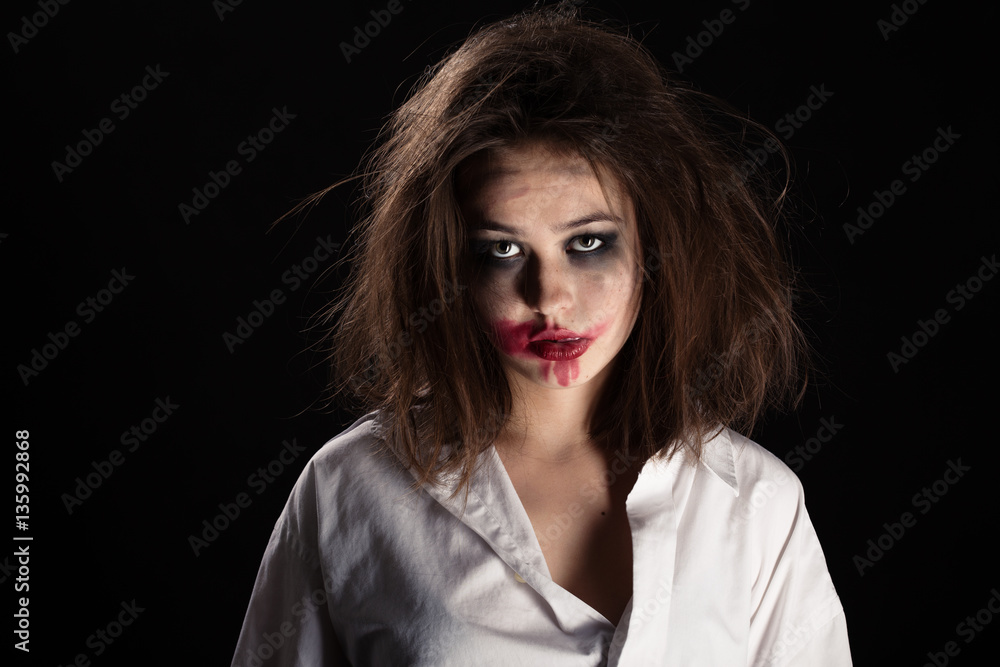 pretty witch with fluffy hair and smeared cosmetics on black background pretty witch with fluffy hair and smeared cosmetics on black background