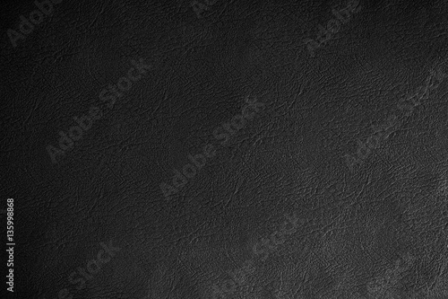 Black leather texture background, close up.