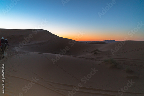 the sun rises in the desert 